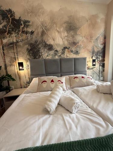 a large white bed with two pillows on it at Belle View Strumyk 212 - Mountain View & SPA in Szklarska Poręba