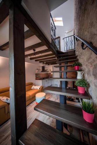 a living room with a staircase in a house at RIVA SUITE 2 in Komiža