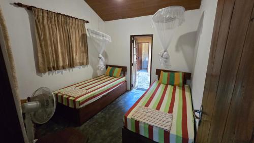 Postel nebo postele na pokoji v ubytování Nature Hub Econ Lodging