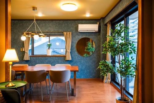 a dining room with a table and chairs at Entire 3 Story house in Hakata in Fukuoka