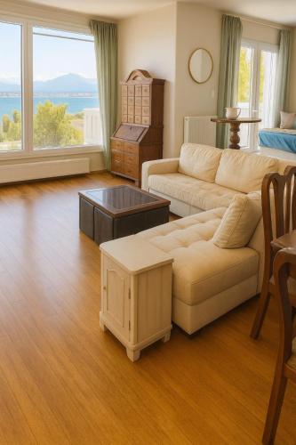 a living room with a couch and a table at Caecilia & Lawrence Organic Mediterranean Sea Villa in Chalkida
