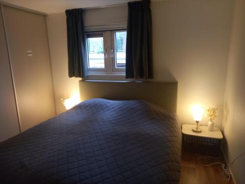 En eller flere senge i et værelse på Serene