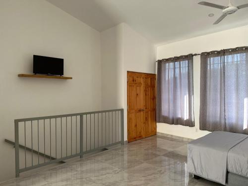 TV a/nebo společenská místnost v ubytování Hotel Bella Tamarindo Guanacaste