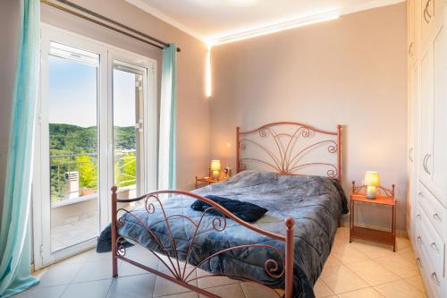 En eller flere senge i et værelse på Villa Tzintzola