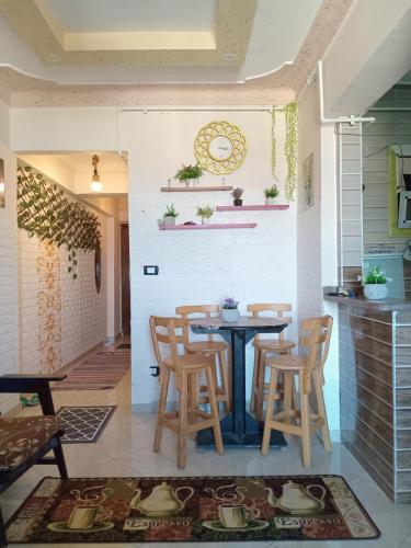 a dining room with a table and chairs at Free Wi-Fi شقة فندقية فى الاسكندرية New apartment sea view Alexandria in Alexandria