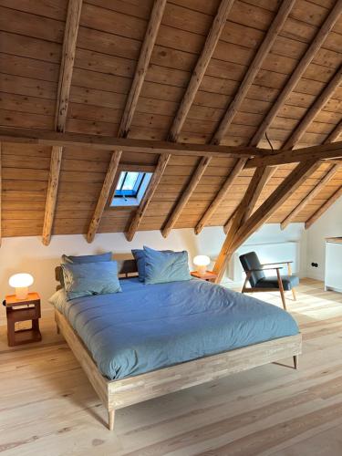 Giường trong phòng chung tại Slapen in Bronkhorst