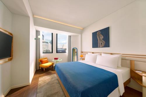 Giường trong phòng chung tại Savvy by M Village Hai Ba Trung - Saigon Downtown