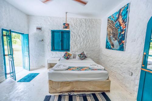 Postel nebo postele na pokoji v ubytování Epic Wild Wilpattu