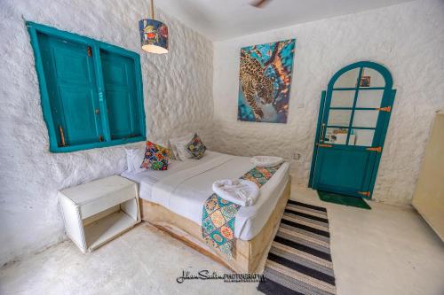 Postel nebo postele na pokoji v ubytování Epic Wild Wilpattu