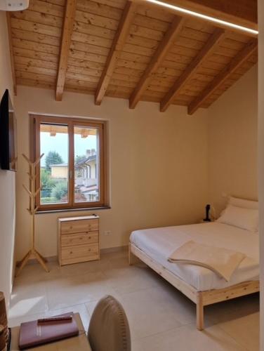 En eller flere senge i et værelse på La Corte dell'Angelo - Rooms