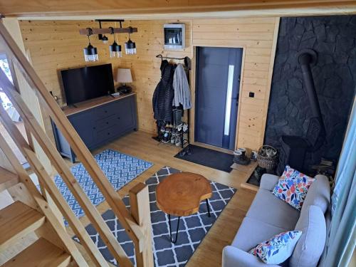 an overhead view of a living room with a couch and a television at Juraszówka in Kamesznica