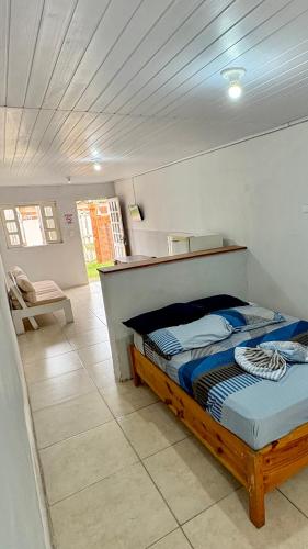 Postel nebo postele na pokoji v ubytování Kitnet a 150m da praia