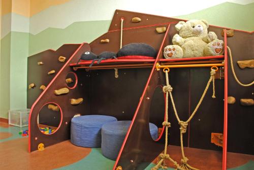 a childrens play area with a play equipment with stuffed animals at Hotel Partizán in Tale