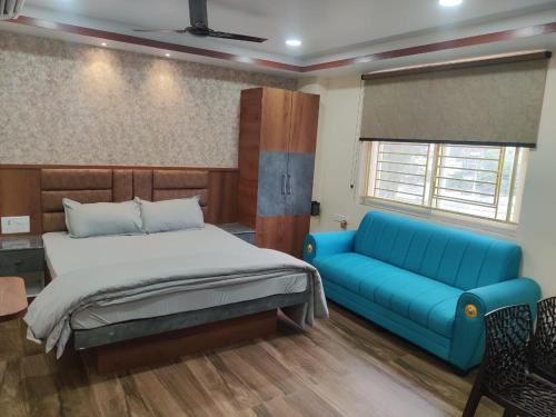 Postel nebo postele na pokoji v ubytování Hotel Satyabhama Lodge