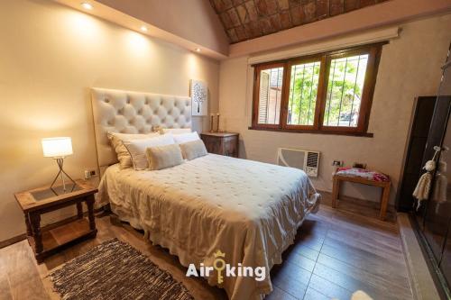 En eller flere senge i et værelse på Chill House Con Pileta