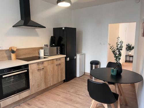 Nhà bếp/bếp nhỏ tại Doux Pavillon - La suite Hirvi - Hyper centre