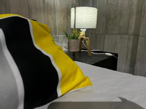 Un pat sau paturi într-o cameră la Hotel La Terminal