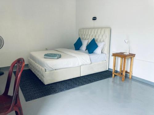 Ένα ή περισσότερα κρεβάτια σε δωμάτιο στο Memo's Inn