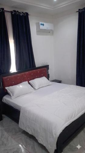 Ένα ή περισσότερα κρεβάτια σε δωμάτιο στο House 22 Apartment