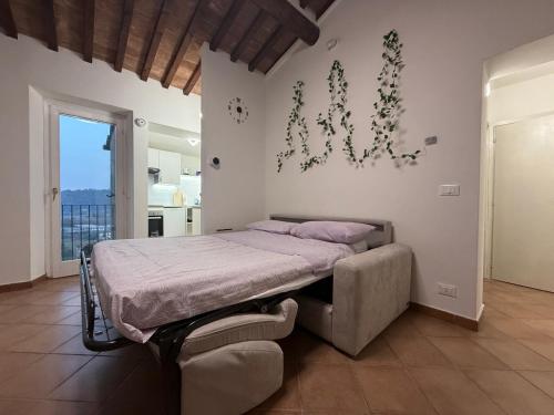 Ένα ή περισσότερα κρεβάτια σε δωμάτιο στο Il Poggiolino d'Oro