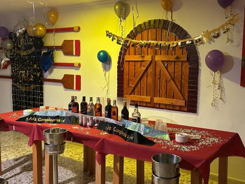 a table with bottles of wine and balloons at El Flamenco in Mojácar
