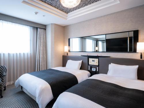 Postel nebo postele na pokoji v ubytování APA Hotel Ueno Ekimae