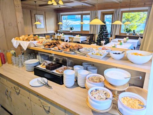 a buffet line with many different types of food at Pension Atlantic in Badia