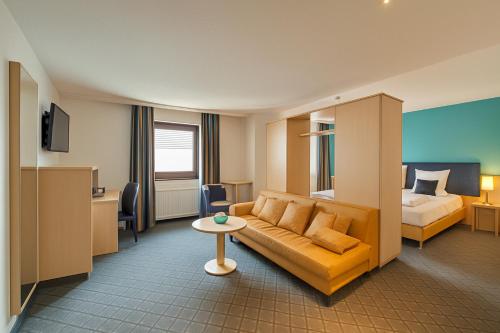 Postel nebo postele na pokoji v ubytování AR Boutique Hotel Mannheim