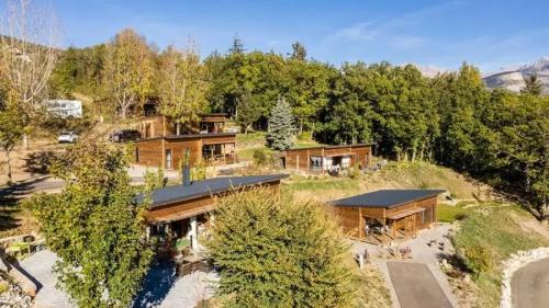 an aerial view of a house in the woods at ZEcamping 3 étoiles pet friendly restaurant avec une vue panoramique in Gap