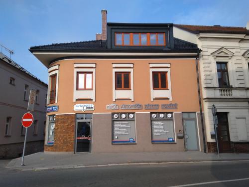 a building on the corner of a street at Apartmán U3 in Týniště nad Orlicí