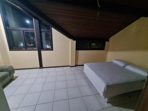 Postel nebo postele na pokoji v ubytování Sobrado em Imbé - RS