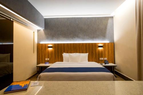 Ένα ή περισσότερα κρεβάτια σε δωμάτιο στο Hotel Soretti