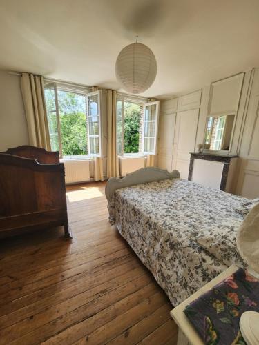 Кровать или кровати в номере Authentique villa de campagne - Grande maison familiale avec jardin - Côte d'Albâtre