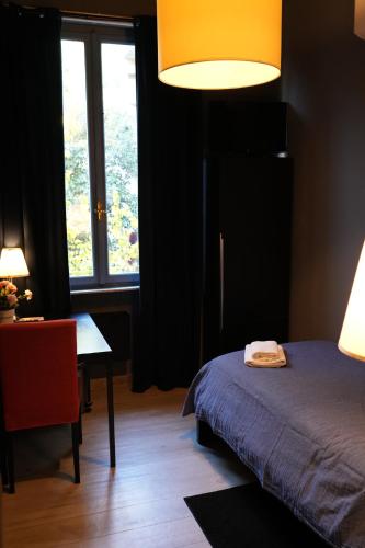 Ένα ή περισσότερα κρεβάτια σε δωμάτιο στο Corridoni Suites