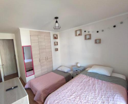 Postel nebo postele na pokoji v ubytování Departamento Central 2 habitaciones, 1 cuadra de la Playa