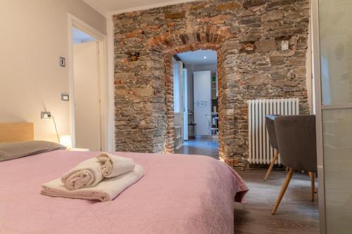 En eller flere senge i et værelse på LA PERLA piccolo appartamento in piazza