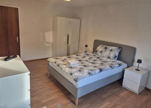 Postel nebo postele na pokoji v ubytování SwissRest - Self Check-In