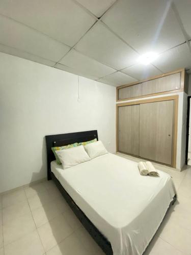 En eller flere senge i et værelse på Paradise in Santa Marta