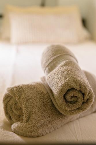 a towel is sitting on top of a bed at Vintage duplex with jacuzzi in Málaga