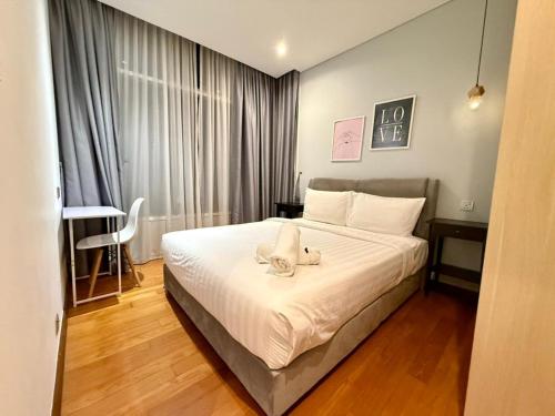 Giường trong phòng chung tại Apartment KL Luxury Home Stay