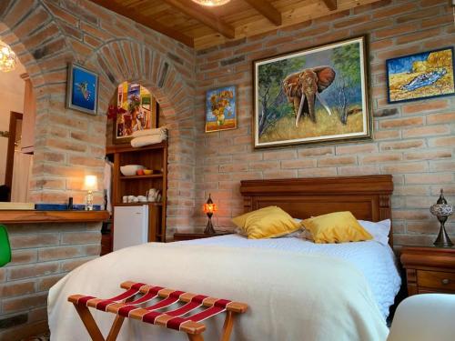 Ένα ή περισσότερα κρεβάτια σε δωμάτιο στο Casa Colibries Cotacachi EC