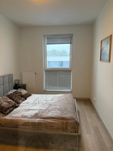 Ένα ή περισσότερα κρεβάτια σε δωμάτιο στο Nova Nowa Apartment