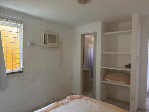 En eller flere senge i et værelse på Casa beira mar Itamaracá