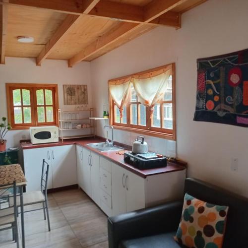 Kuchyň nebo kuchyňský kout v ubytování Cabañas Pachamama