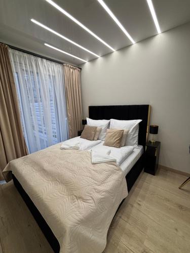 Postel nebo postele na pokoji v ubytování Apartament GOLD Perłowa Przystań