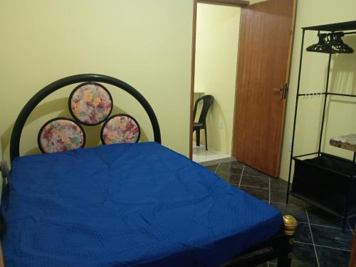 En eller flere senge i et værelse på Casa três com cozinha compartilhada