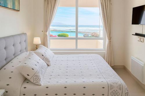 Ένα ή περισσότερα κρεβάτια σε δωμάτιο στο Vive la magia del mar cada día desde tu terraza