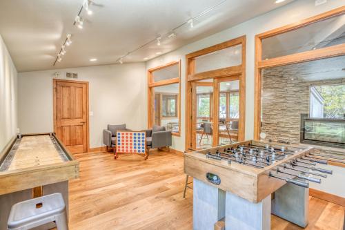 a living room with two foosball tables at River Ridge 316B in Bend