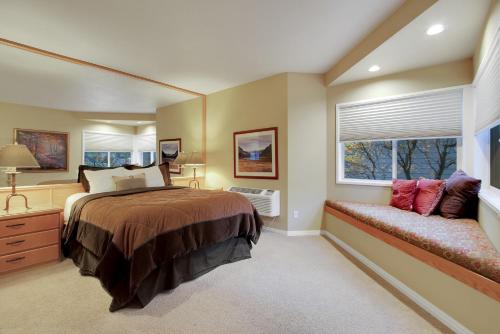 a bedroom with a large bed and a window at River Ridge 316B in Bend