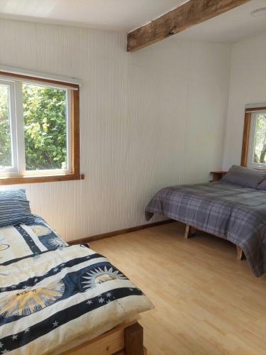 Postel nebo postele na pokoji v ubytování Cabañas Pirineos